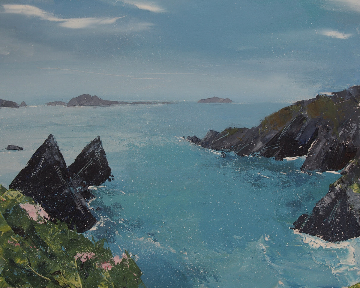 An oil painting of a coastal landscape featuring deep blue and turquoise ocean water, dark jagged rock formations, distant islands, and a cloudy blue sky.