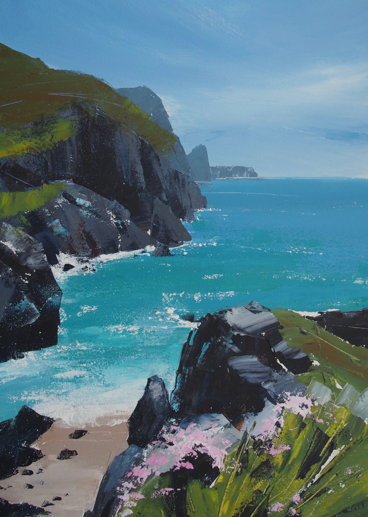 Impressionistic landscape painting of a rocky coastal inlet with turquoise ocean water, dark cliffs, green grassy slopes, a small sandy beach, and pink flowers in the foreground under a pale blue sky.