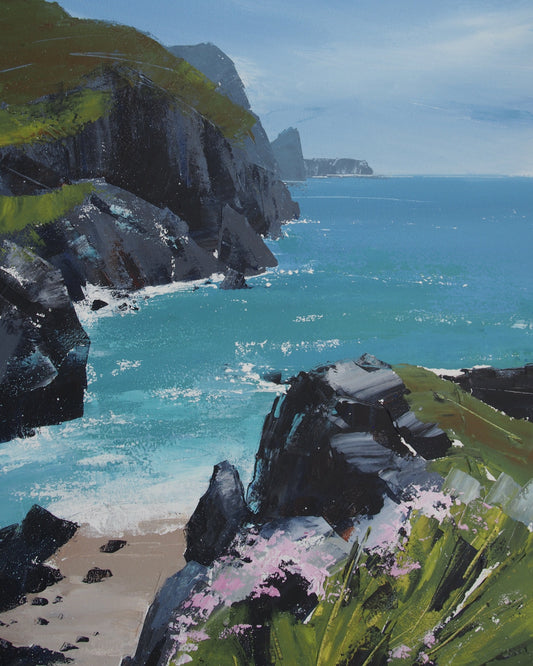 A landscape painting of a rocky coastal inlet with turquoise water, dark cliffs, green grassy slopes, a small sandy beach, and pink flowers in the foreground.
